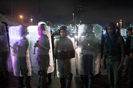 Fnideq (Morocco), 16/09/2024.- Moroccan public security forces deploy near a customs checkpoint along the land border with the Spanish enclave of Ceuta, in Fnideq, northern Morocco, 16 September 2024. Hundreds of migrants on 15 September stormed a barbed wire fence to cross the land border from Fnideq to Ceuta, following a call on social media for a mass migration attempt, authorities said. According to Spanish police, they were all prevented from entering following a large deployment of security forces on both sides of the border. (tormenta, Marruecos, España) EFE/EPA/JALAL MORCHIDI