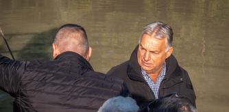 Hungary's Prime Minister Viktor Orban (R) sits in a boat with local residents in Visegrad, 35 km north from the Hungarian capital Budapest, during a trip to monitor the flood preparations as the storm Boris affects the country, on September 19, 2024. Hungarian premier Viktor Orban postponed all of his
