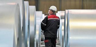 FILE - In this April 27, 2018 file photo, a worker controls steel coils at the thyssenkrupp steel factory in Duisburg, Germany. The European Union and the United States have decided to temporarily suspend measures at the heart of a steel tariff dispute that is seen as one of the major trade issues dividing the two sides. The issue goes back to the 2018 tariffs that then-President Donald Trump slapped on EU steel and aluminum, which enraged Europeans and other allies by calling their metals a threat to U.S. national security. (AP Photo/Martin Meissner, File)