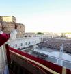 This photo taken and handout on May 7, 2025 by The Vatican Media shows Newly elected Pope Leo XIV, Robert Prevost addressing the crowd from the main central loggia balcony of the St Peter's Basilica for the first time, after the cardinals ended the conclave, in The Vatican. (Photo by Handout / VATICAN MEDIA / AFP) / RESTRICTED TO EDITORIAL USE - MANDATORY CREDIT