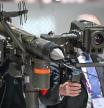 VILLEPINTE, FRANCE - JUNE 21: An attendee looks through the sights of a weapon in the pavilion of the French Ministry of the Armed Forces during the Eurosatory Defense and Security expo in, on June 21, 2024, in Paris-Nord Villepinte exhibition center, Seine-Saint-Denis, France. Eurosatory, held biennially in Paris-Nord Villepinte Exhibition Centre, is the largest international exhibition for the land and air-land defense and security industry. (Photo by Artur Widak/NurPhoto via Getty Images)