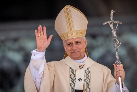 18 May 2025, Vatican, Vatican City: Pope Leo XIV waves to the crowd during his inauguration at St. Peter's Square. Robert Francis Prevost is the first pontiff from the United States. Photo: Michael Kappeler/dpa