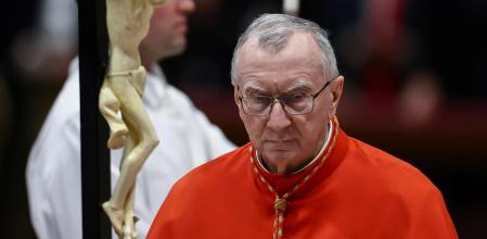 Vatican's Secretary of State, Cardinal Pietro Parolin, walks after kissing the cross during the Good Friday Passion of the Lord service in Saint Peter's Basilica at the Vatican, April 18, 2025. REUTERS/Yara Nardi