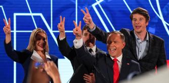 Polish presidential candidate Karol Nawrocki, backed by the main opposition Law and Justice (PiS) party, his wife Marta Nawrocka, his sons Antoni and Daniel gesture as they react to the exit polls of the second round of presidential election, in Warsaw, Poland, June 1, 2025.