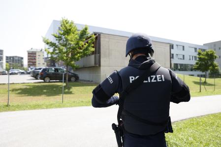 A policeman is seen close to a school where, according to reports, several people died in a shooting, on June 10, 2025 in Graz, southeastern Austria. Several people died in a school shooting, including the attacker, Austrian broadcaster ORF quoted the interior ministry as saying.