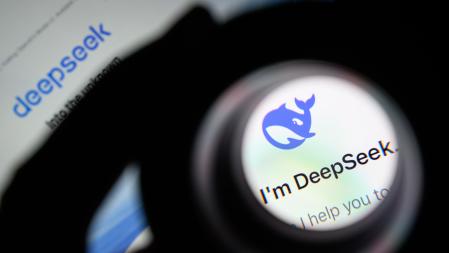 LONDON, ENGLAND - JANUARY 29: In this photo illustration, the Deepseek logo is seen through a magnifying loupe while displayed on a mobile phone screen on January 29, 2025 in London, England. This week's news that the DeepSeek Chatbot app, developed by China, was downloaded from the Apple app store significantly more times than the US-developed ChatGPT from Open AI, wiped billions off the global tech market. The advent of DeepSeek has shown there is a more viable, efficient, and cost-effective future for AI development in a shift away from the current high cost, high tech model. (Photo by Leon Neal/Getty Images)