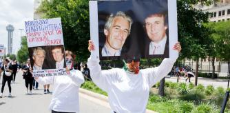 June 14, 2025, Dallas, Texas, USA: Two women holding images of Donald Trump and convicted sex trafficker Jeffrey Epstein who committed suicide in prison, during the No Kings protest in downtown Dallas Texas on Saturday.