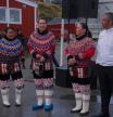 Locals wearing a traditional clothing made of pearl collar and seal hides participate during the National Day in Nuuk, Greenland (AP Photo/Kwiyeon Ha)