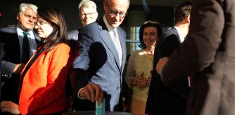 Friedrich Merz, Germany's chancellor-in-waiting and leader of the conservative Christian Democratic Union party (CDU) votes following an extraordinary session of the outgoing lower house of parliament, the Bundestag, for a vote to adopt the draft law brought by the SPD and CDU/CSU parliamentary groups to reform constitutional debt rules and set up a 500 billion euro infrastructure fund, in Berlin, Germany March 18, 2025. Michael Kappeler/Pool via REUTERS
