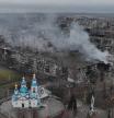 TOPSHOT - This undated handout photograph released by the National Police of Ukraine on December 12, 2025 shows an aerial view of heavily damaged residential buildings and a church in the frontline town of Kostyantynivka, Donetsk region, amid the Russian invasion of Ukraine. (Photo by Handout / National Police of Ukraine / AFP) / RESTRICTED TO EDITORIAL USE - MANDATORY CREDIT 