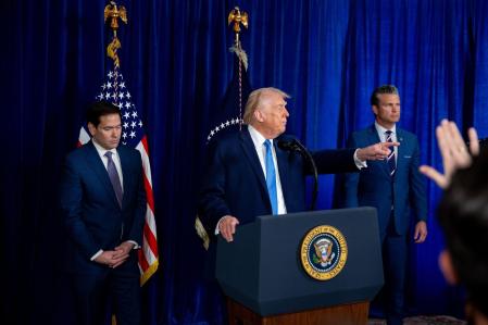 Marco Rubio, US secretary of state, from left, US President Donald Trump, and Pete Hegseth, US secretary of defense, during a news conference at the Mar-a-Lago Club in Palm Beach, Florida, US, on Saturday, Jan. 3, 2026. President Nicolas Maduro has been charged in the US after he was captured and flown out of Venezuela, following a series of airstrikes that mark an extraordinary escalation in the Trump administration's months-long campaign against the country. Photographer: Nicole Combeau/Bloomberg