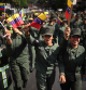 TOPSHOT - Members of the National Anti-drugs Command shout slogans during a rally in support of ousted Venezuela's President Nicolas Maduro and his wife Cilia Flores in Caracas on January 6, 2026. US forces killed 55 Venezuelan and Cuban military personnel during their stunning raid to capture Nicolas Maduro, tolls published by Caracas and Havana showed on January 6. (Photo by Federico PARRA / AFP)